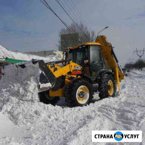 Услуги экскаватора-погрузчика с ямобуром Томск