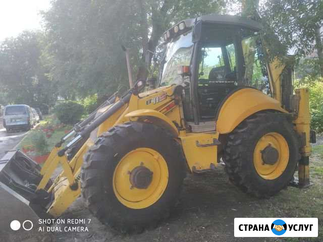Услуги экскаватора-погрузчика New Holland Томск - изображение 1