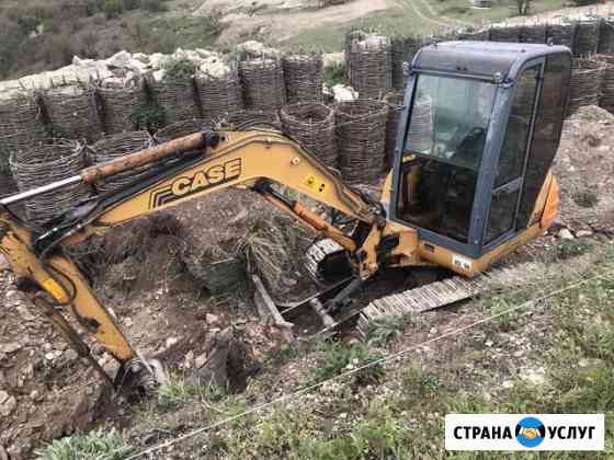 Аренда гусеничного мини-экскаватора с гидромолотом Севастополь