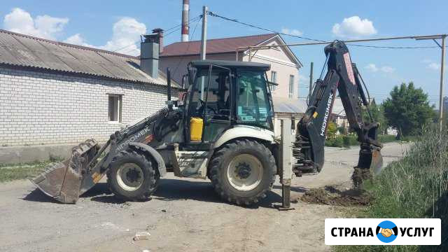 Аренда экскаватора-погрузчика ковш 0,24 куба Волгоград - изображение 1