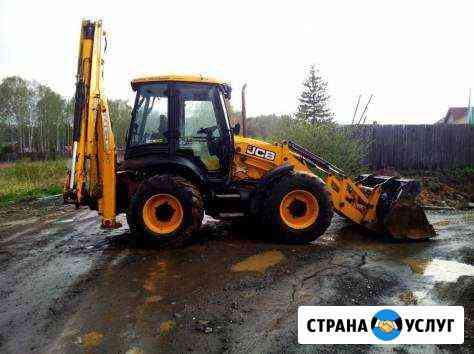 Аренда экскаватора погрузчика с ямобуром Екатеринбург