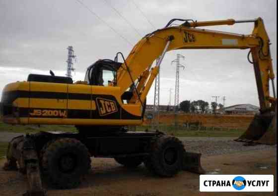 Аренда колёсного полноповоротного экскаватора JCB Москва