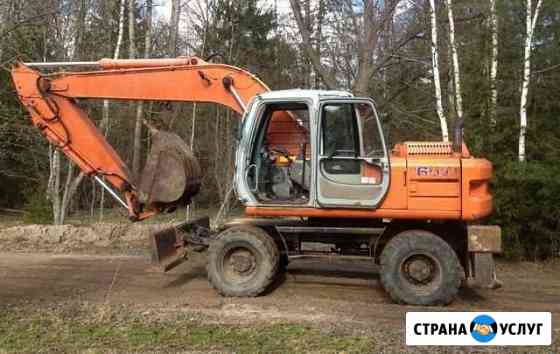 Аренда экскаватора колёсного Hitachi EX 165W Москва