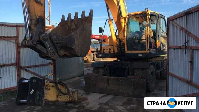 Аренда колесного полноповоротного экскаватора Москва - изображение 1