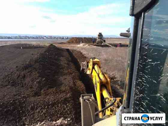 Услуги экскаватора погрузчика Феодосия